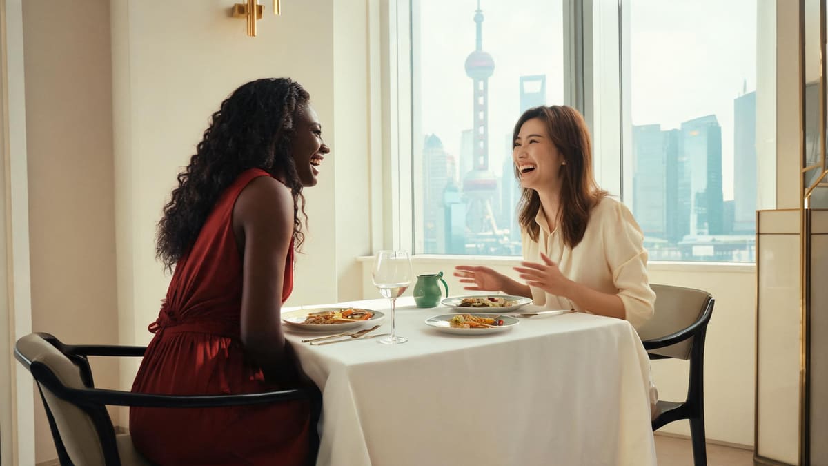 Two friends over a long set lunch in a bright Shanghai dining room with Pudong skyline views