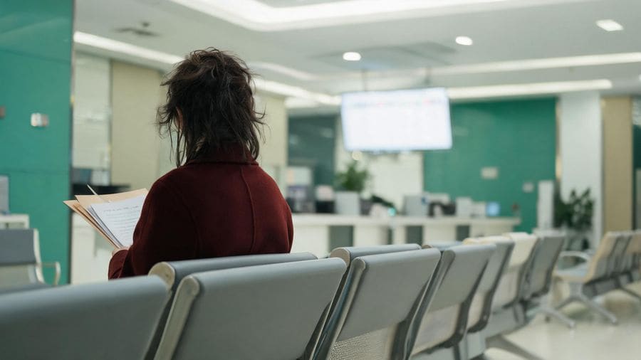 Waiting at a Shanghai social insurance bureau to claim a pension refund before leaving China