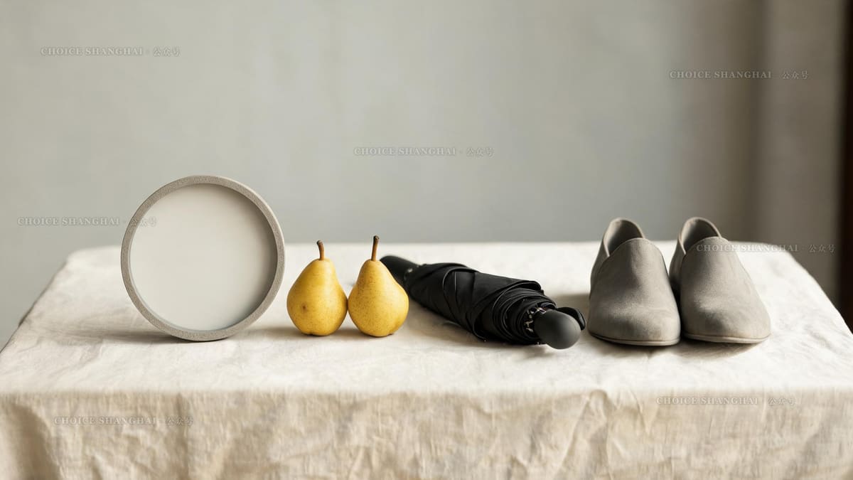 Gifts to avoid in Chinese culture arranged on a table: a wall clock, pears, a black umbrella and shoes