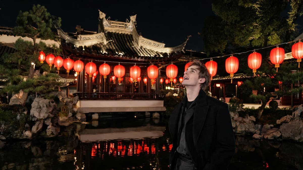 Red lanterns glowing over a classical garden pavilion at Yu Garden in Shanghai at night