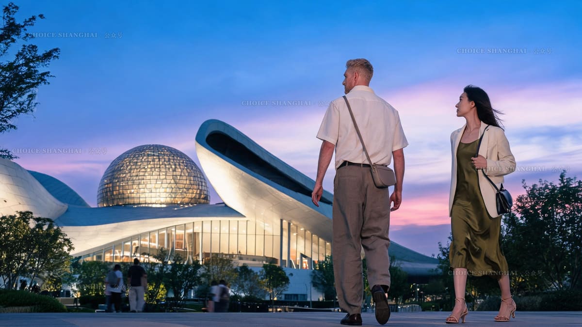 The Shanghai Astronomy Museum in Lingang at dusk, its sweeping white curves and glass sphere against a dramatic sky