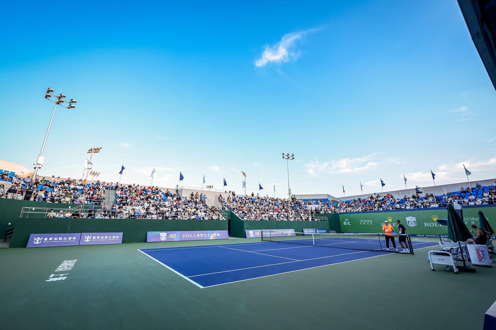 The practice and side courts at the Shanghai Masters on a sunny afternoon, players warming up