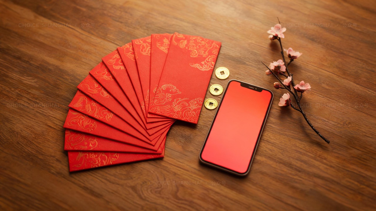A fan of red lucky-money envelopes with gold patterns beside a phone and plum blossom on a warm wooden table