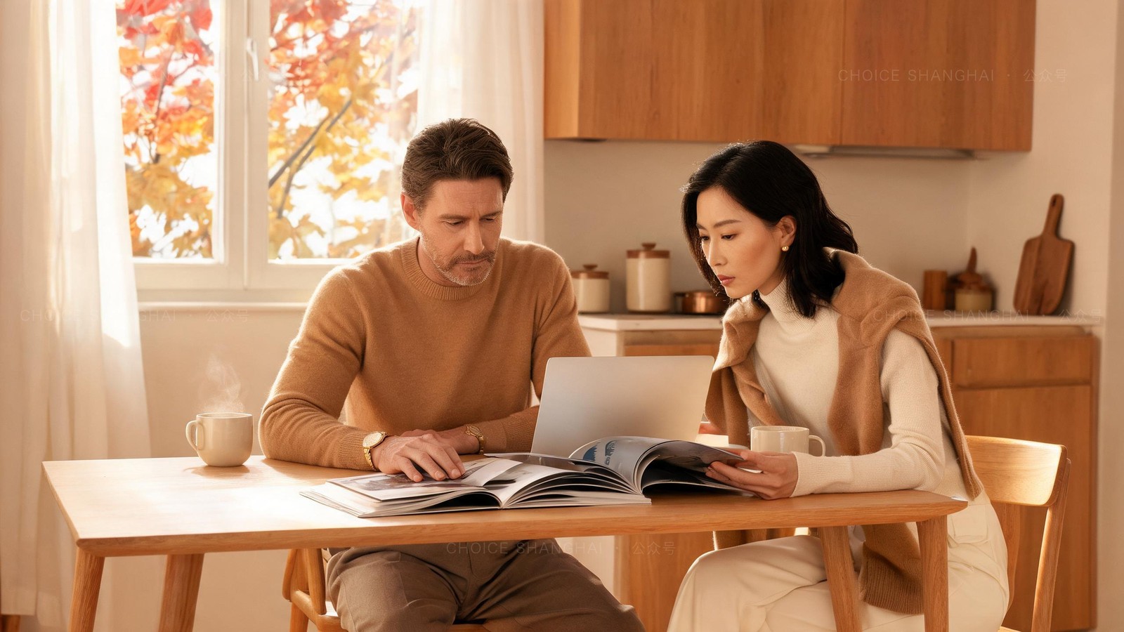 Two parents comparing school brochures and a laptop at a kitchen table in warm autumn light