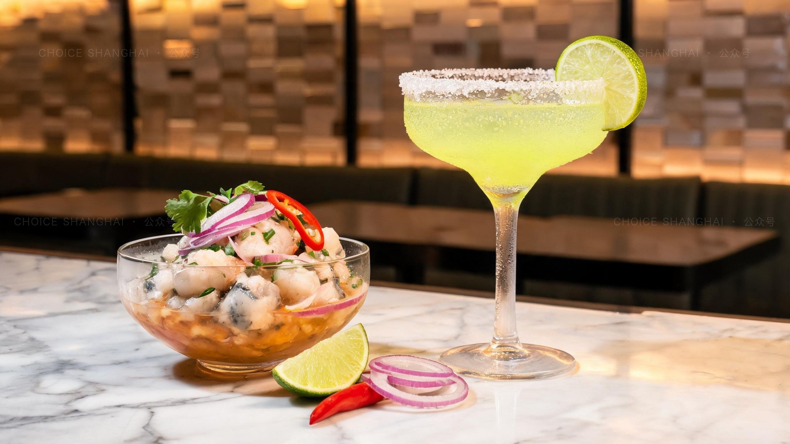 Fresh Peruvian ceviche with red onion and chili beside a bright margarita on a marble bar counter in a modern Shanghai Latin restaurant