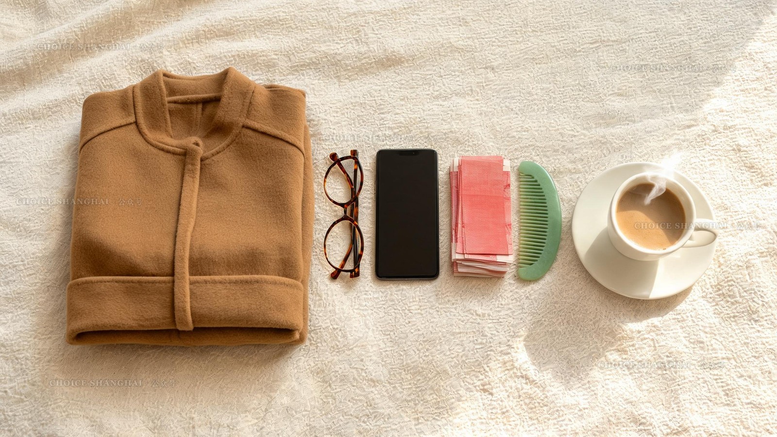 Flat-lay of things worth buying in Shanghai: tortoiseshell glasses, a wool coat, a phone, banknotes, a jade comb and coffee
