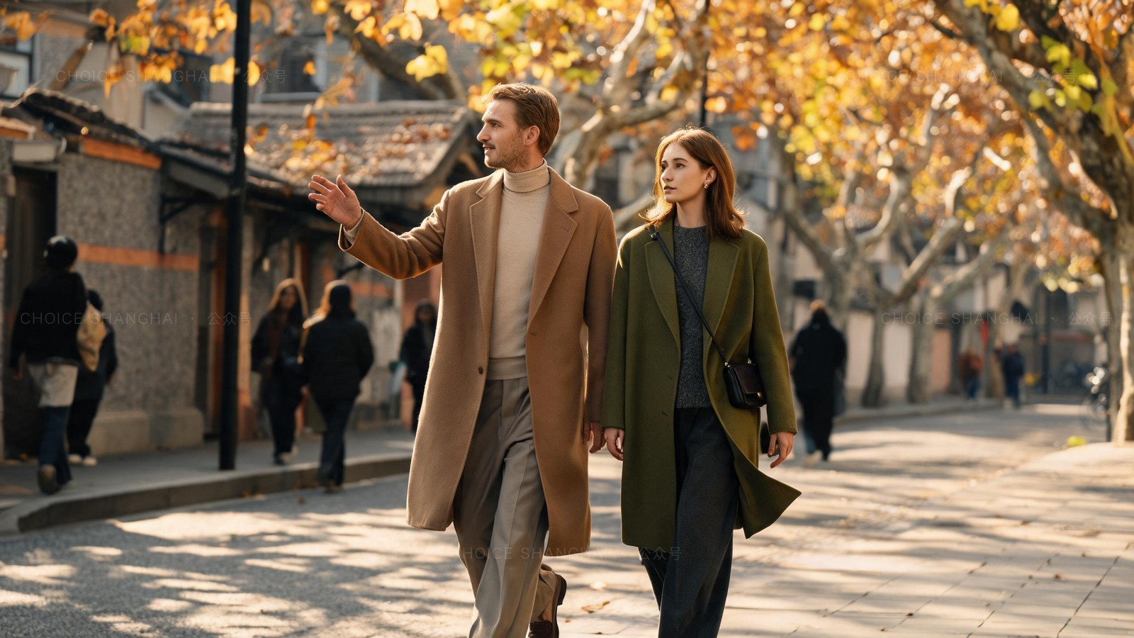 A couple walking a Shanghai street in autumn, one animated about the city, the other quieter and looking away