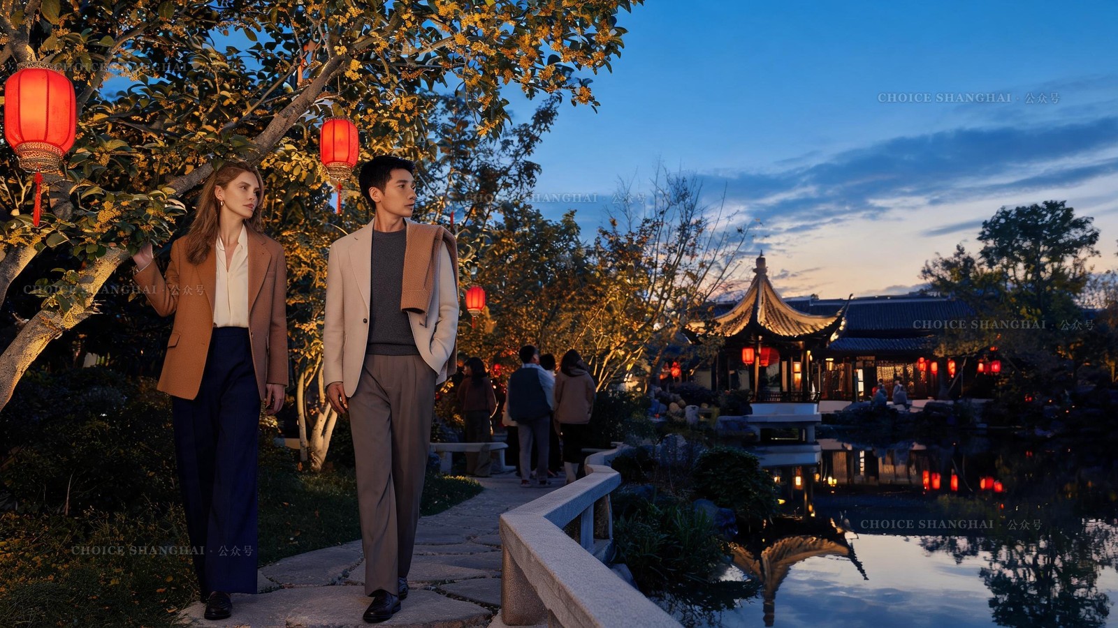 Red lanterns glowing at dusk over a lit pavilion and osmanthus trees during the Mid-Autumn festival at a classical Shanghai garden