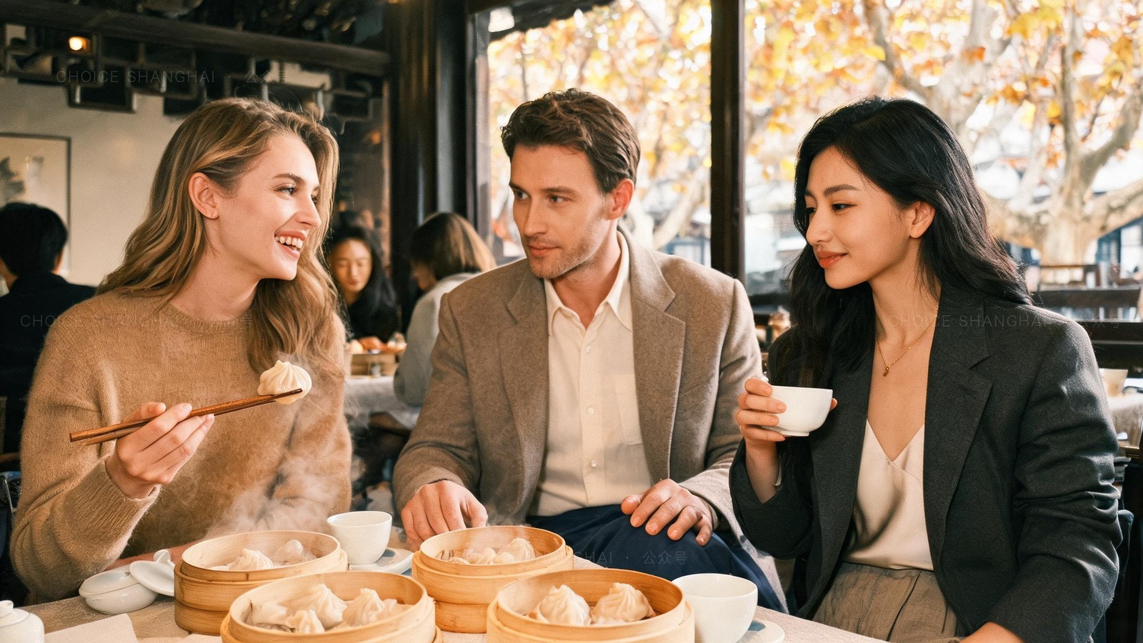 Three friends sharing a Cantonese dim sum lunch at a bright Shanghai restaurant, bamboo steamers between them, one woman lifting a dumpling with chopsticks and laughing