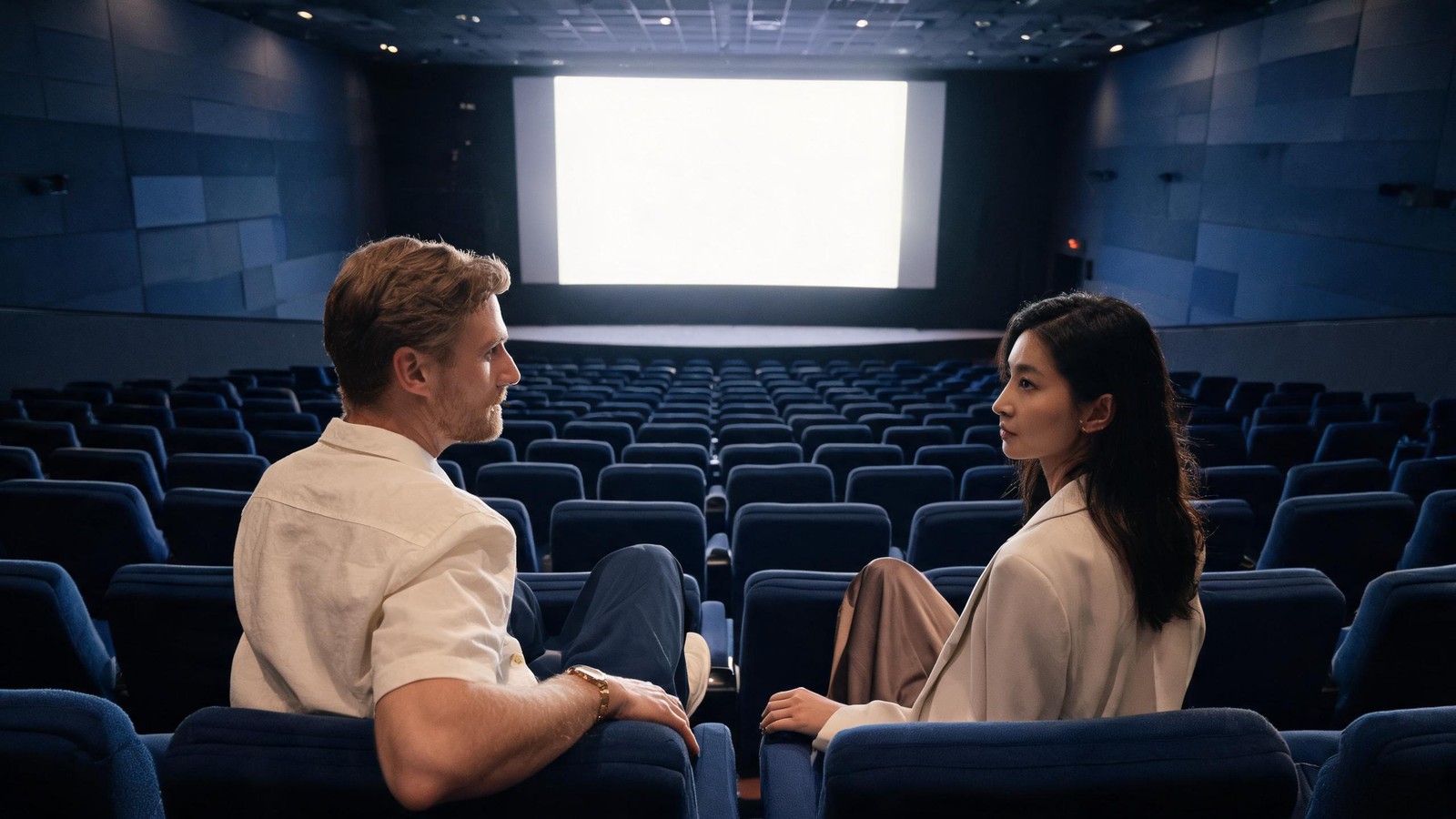 The interior of a Shanghai cinema auditorium with blue seats and a large blank screen