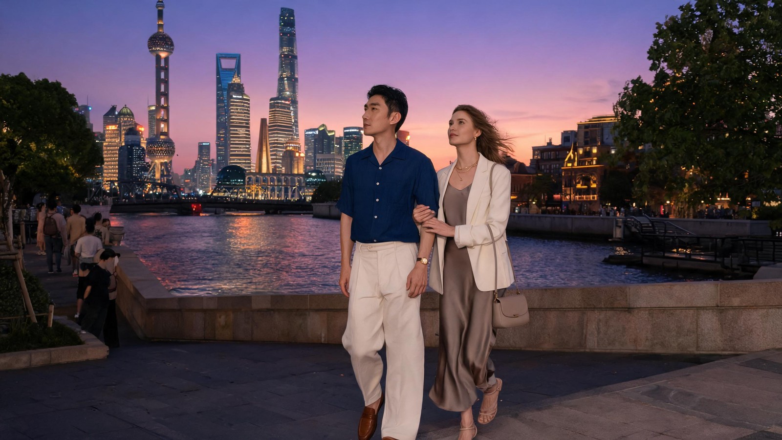 The Bund at dusk as the Pudong Lujiazui towers light up against a peach and violet afterglow sky over the Huangpu river